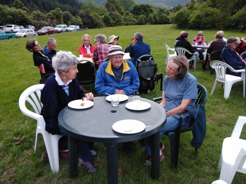 Veteran volunteers enjoying end of year BBQ on the lawns in front of the Catchpool Centre